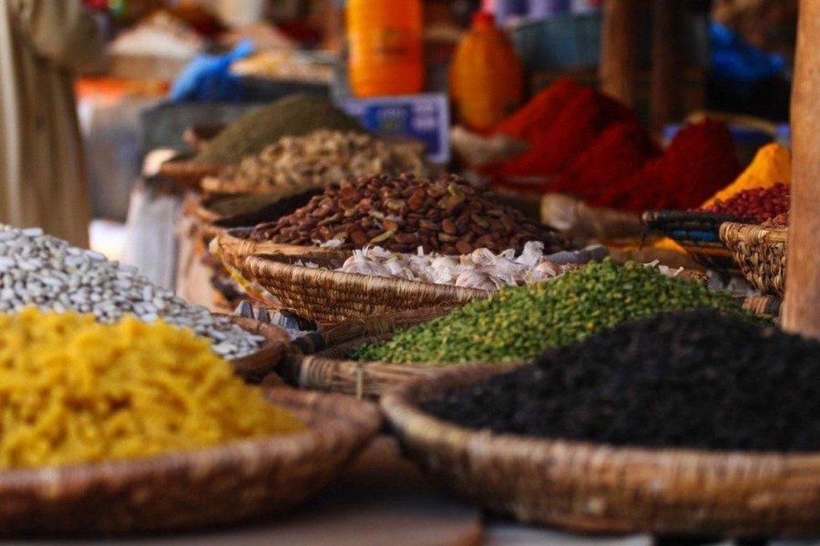 Baskets of colourful spices at a Zanzibar market